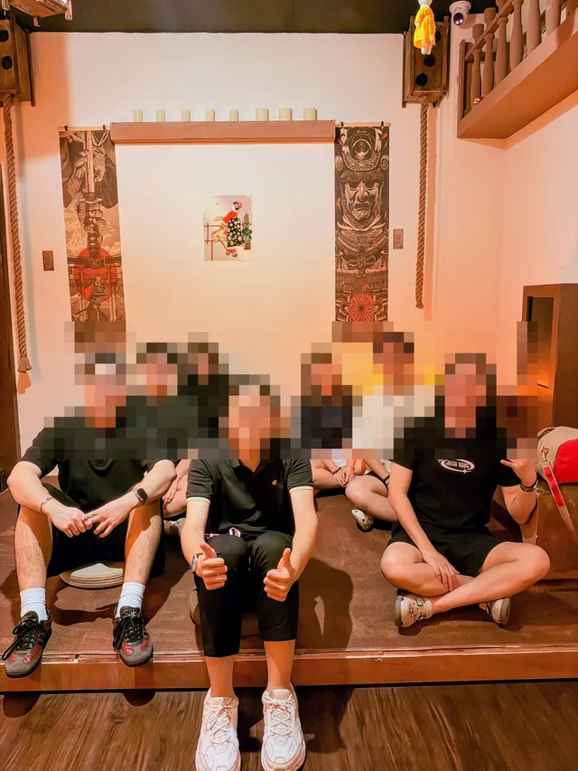 The seven of us smiling together after an escape room in JB.